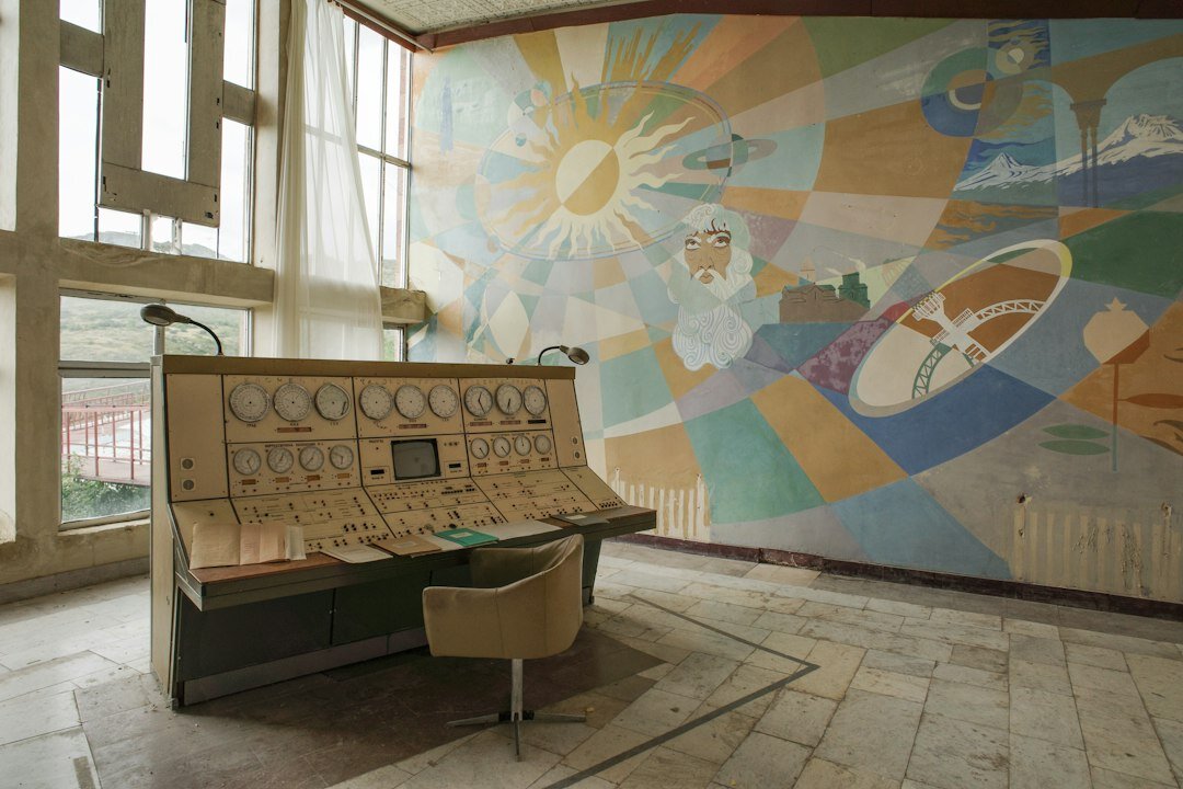 Wide view of a television gallery with switcher desk and preview wall